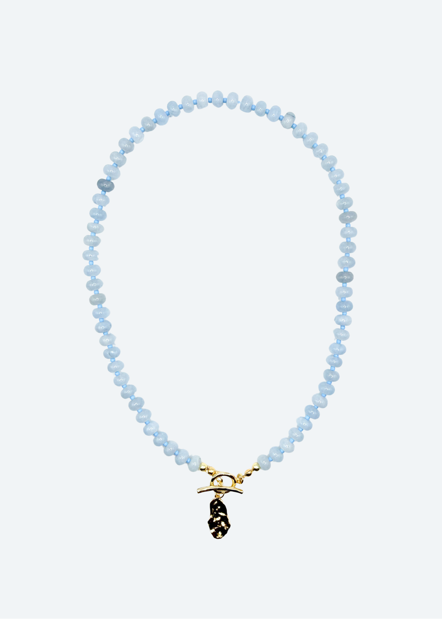 The Lana Blue Beaded Oyster Shell Charm Necklace detail view by London Crafted