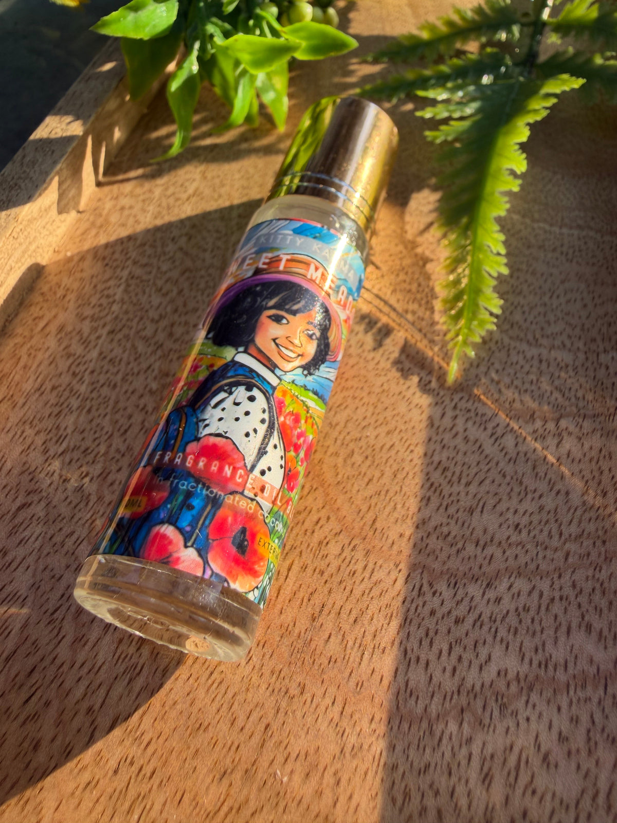 Detail view of Kitty Karma Studio Sweet Meadow perfume roller packaging
