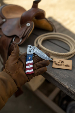 Patriot Damascus Folding Knife 7” opened – American Flag Handle with Leather Sheath