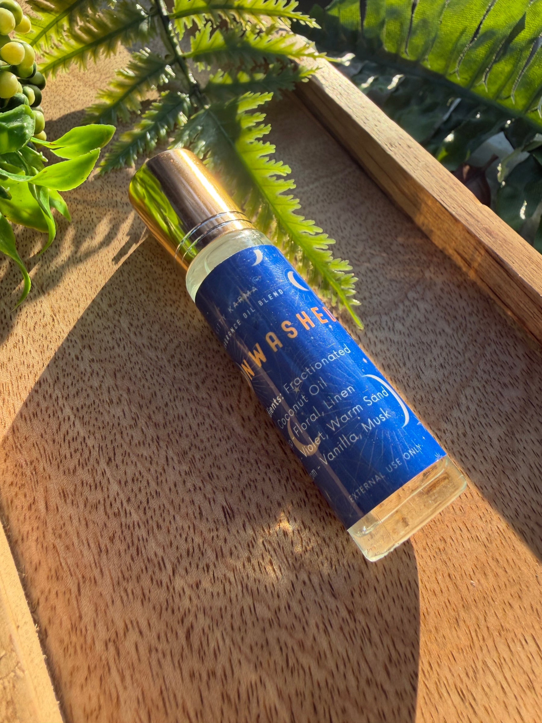 Detail view of Kitty Karma Studio Moonwashed perfume roller packaging