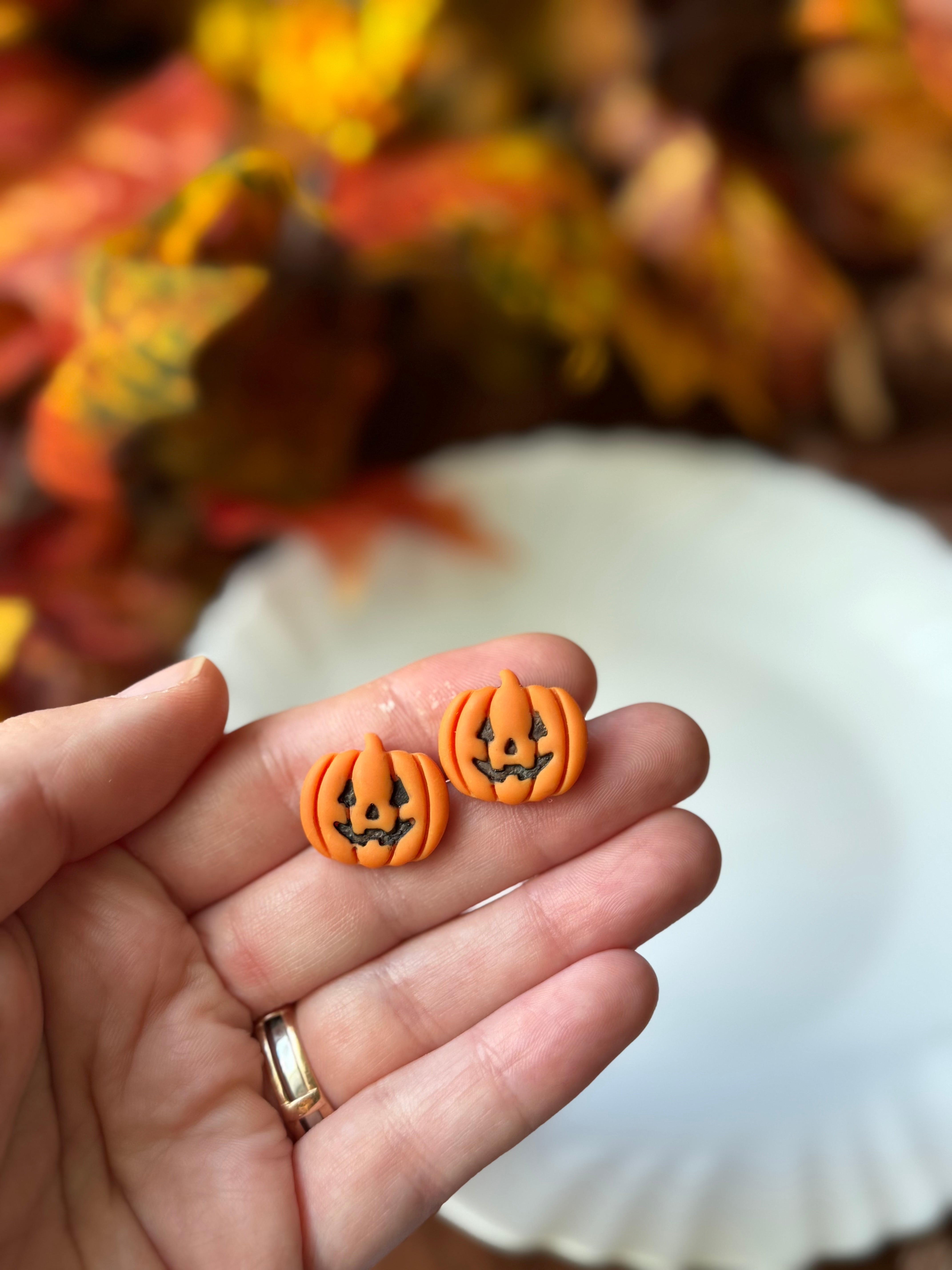 Jack-O-Lantern Studs handmade polymer clay earrings by Shop Something Earthy — view 1 of 2