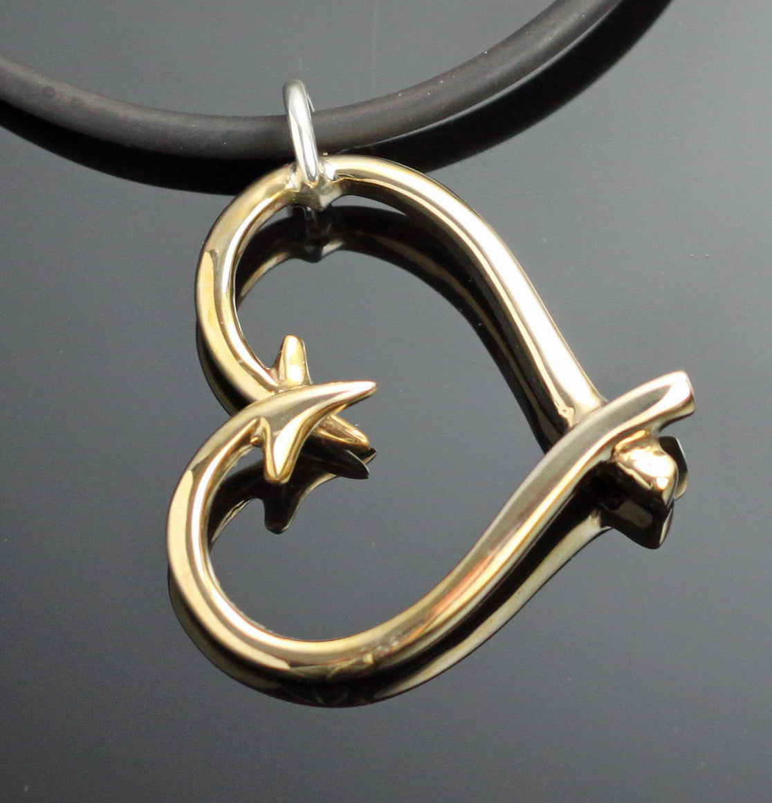 Bronze hook heart pendant on brown leather cord with silver bail