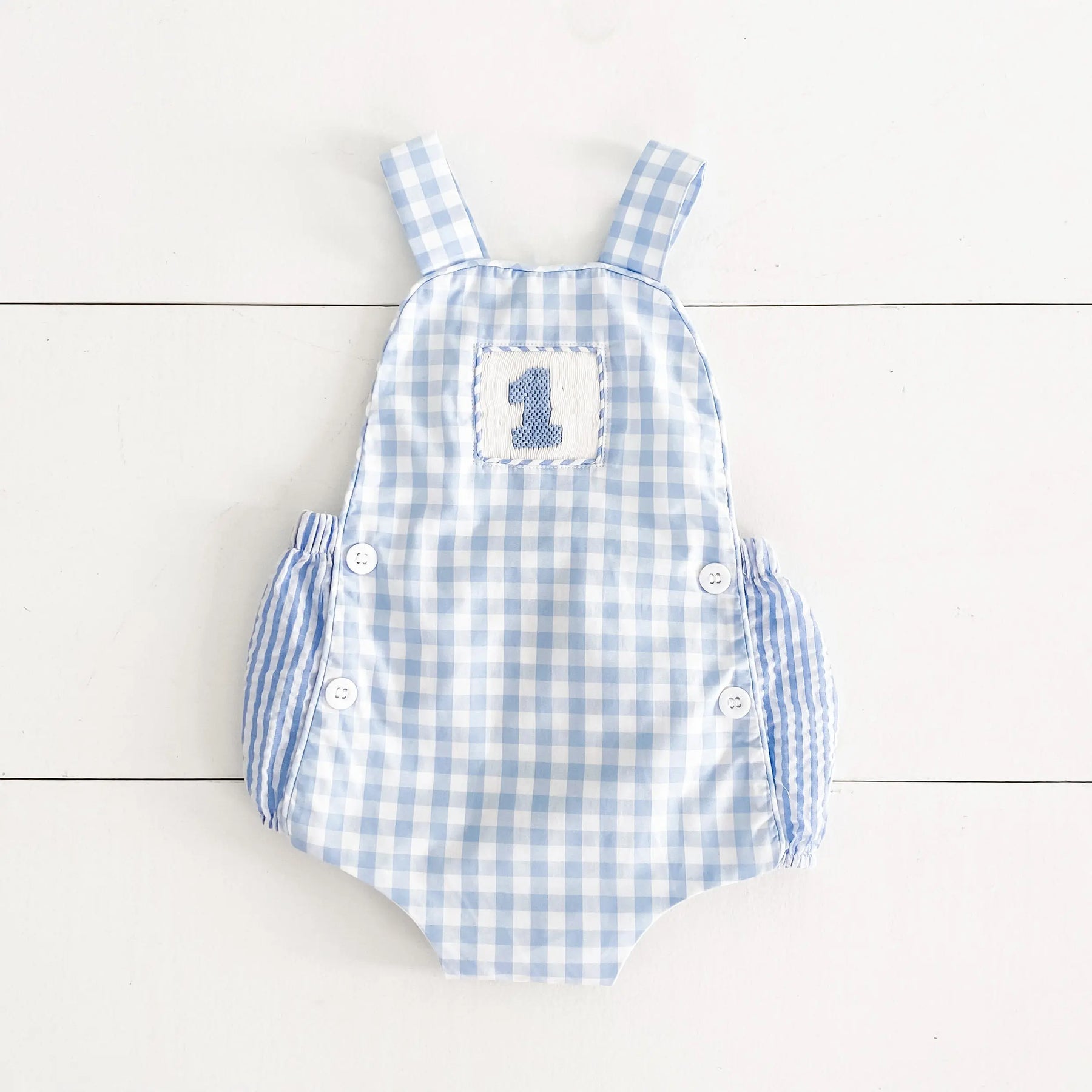Baby Boy First Birthday Outfit – Smocked Blue Birthday Bubble by Seven Lantern Lane, children's boutique clothing main product photo