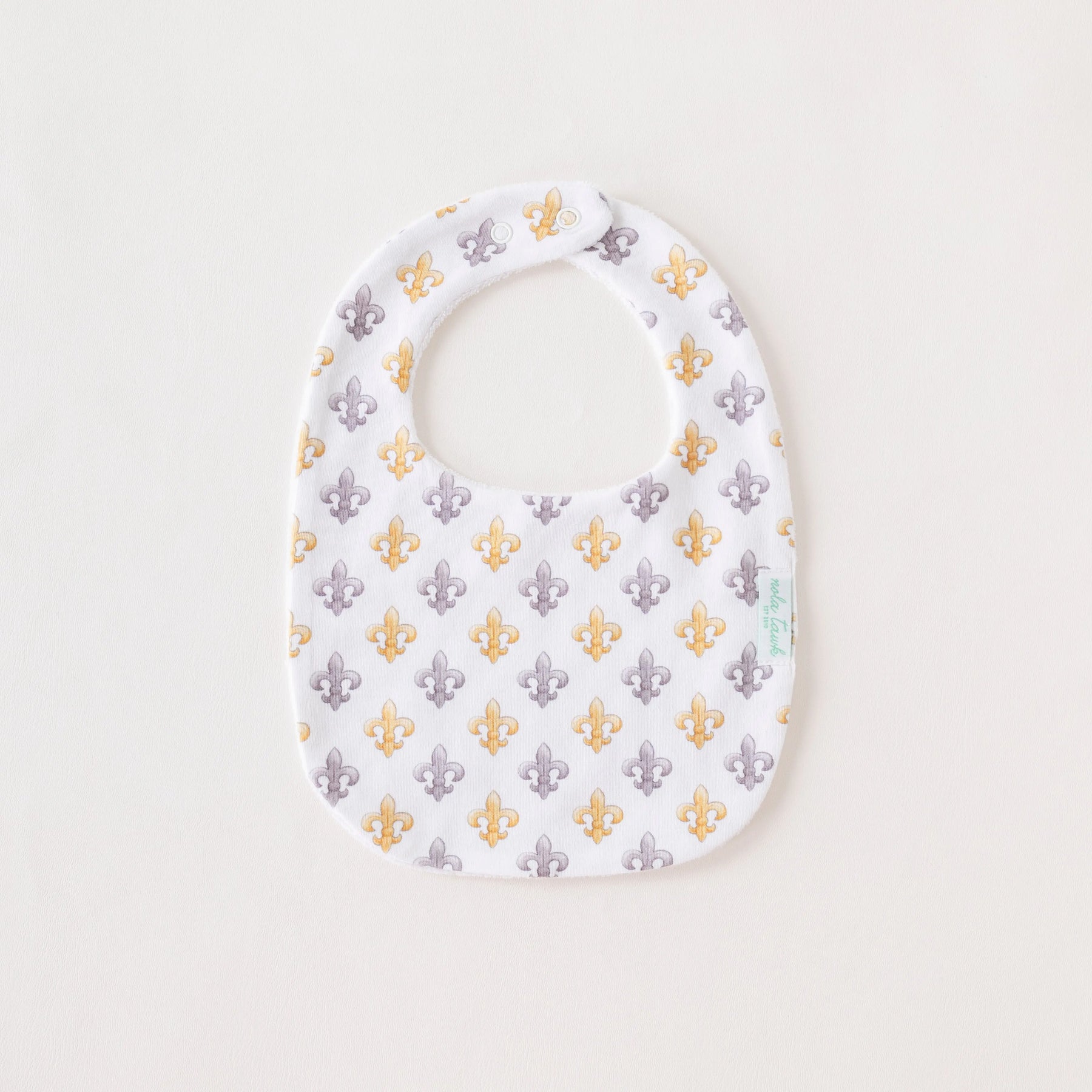 Black and Gold Fleur de Lis Organic Cotton Baby Bib by Nola Tawk, children's boutique clothing main product photo