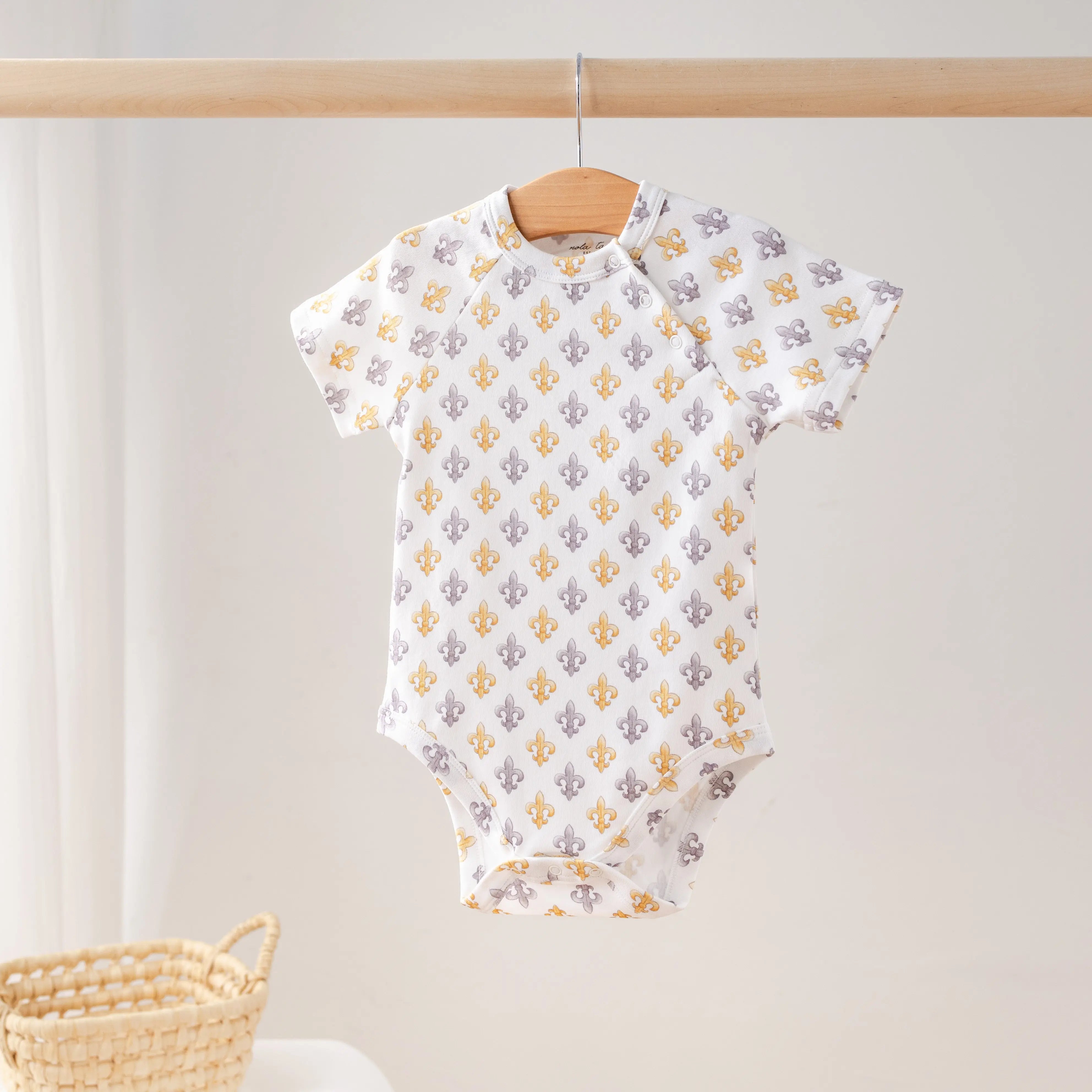 Black and Gold Fleur de Lis Organic Cotton Onesie by Nola Tawk, Southern lifestyle apparel main product photo