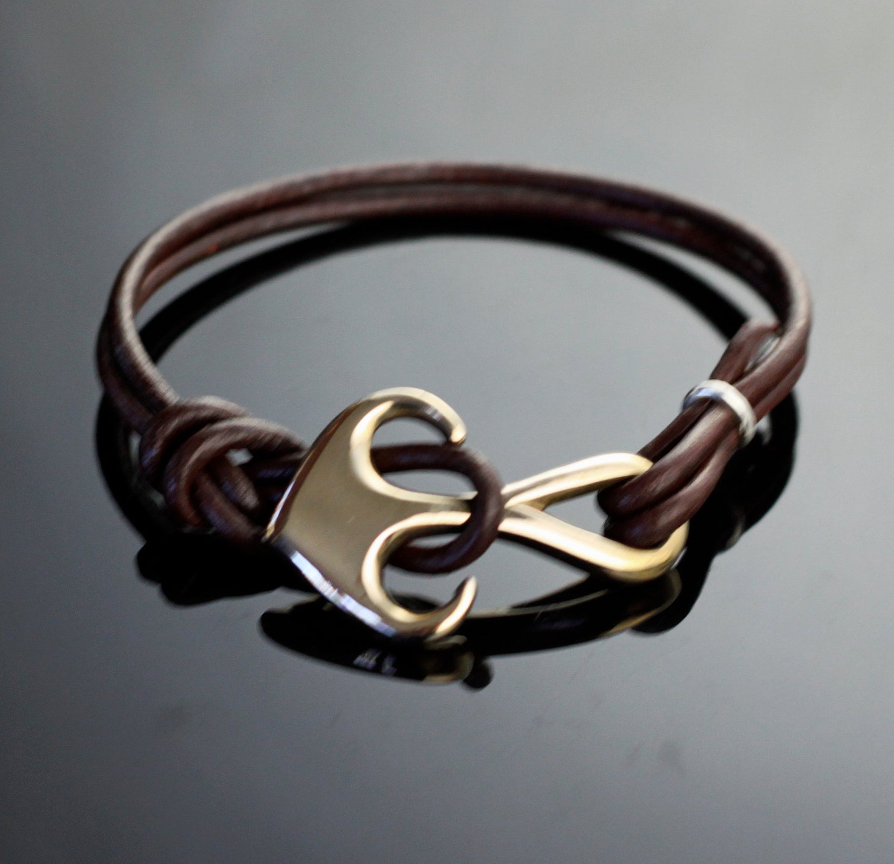 Bronze Curvy Anchor Bracelet on Double Leather by Anisa Jewelry