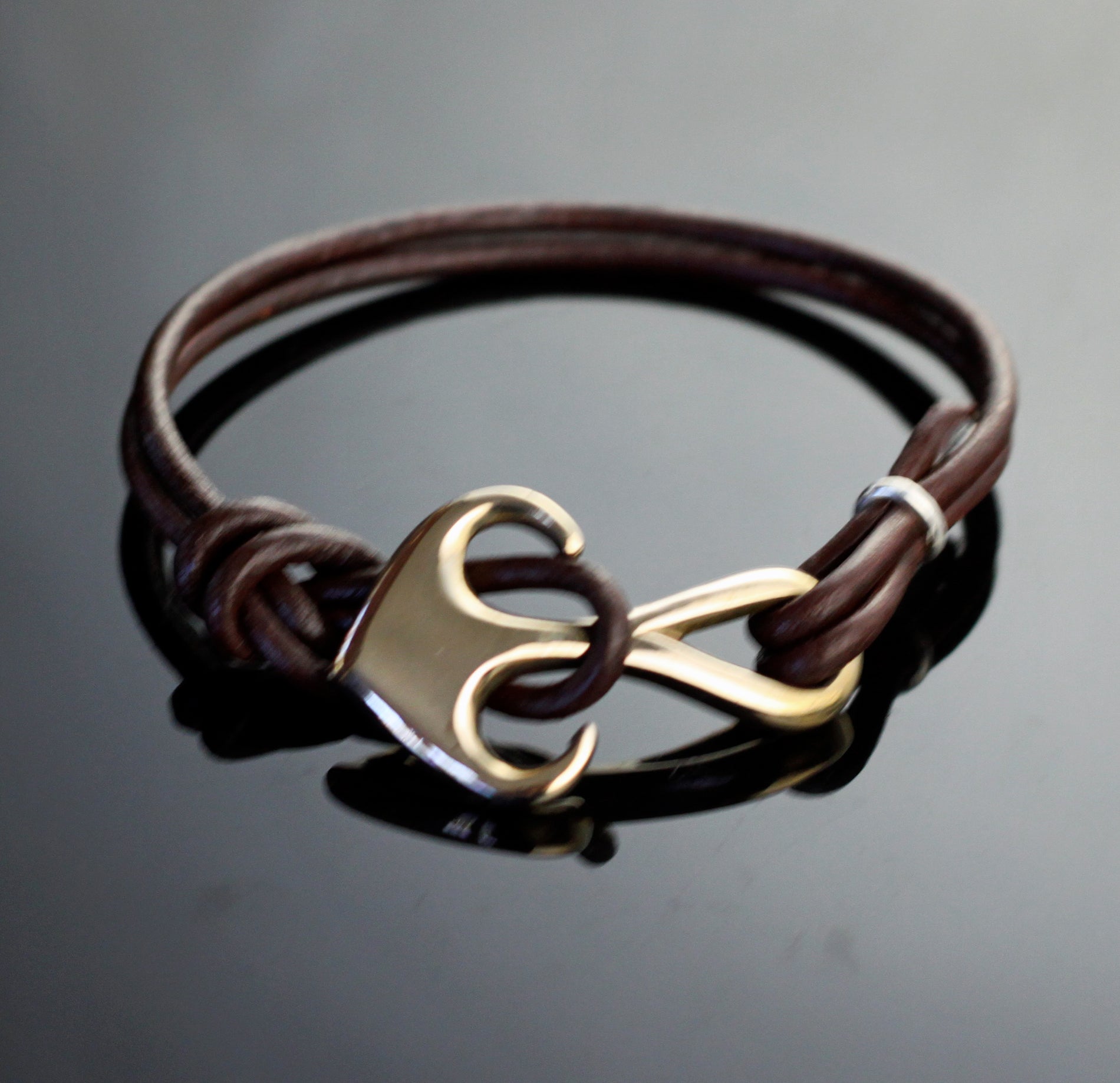 Bronze Curvy Anchor Bracelet on Double Leather by Anisa Jewelry
