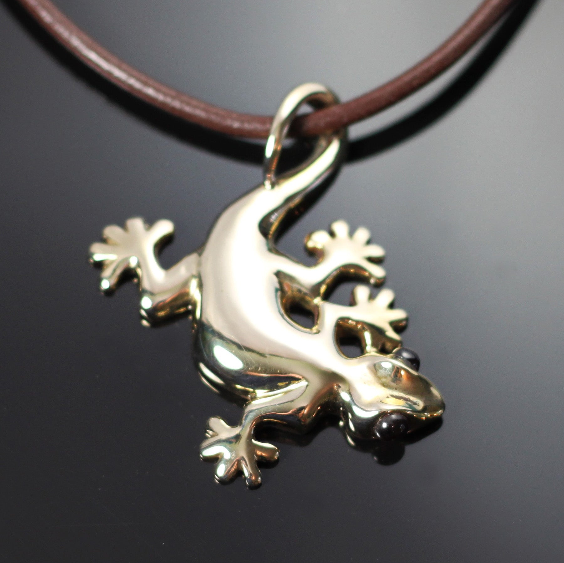 Large Bronze Gecko Pendant with Garnet Eyes by Anisa Jewelry