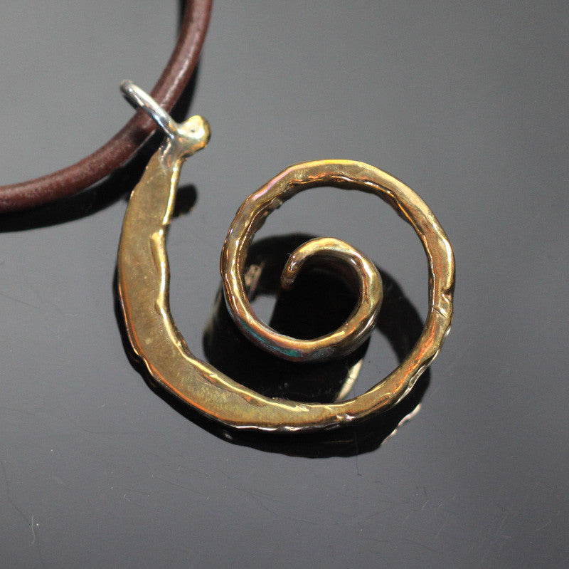 Large Bronze Spiral Pendant on Leather Cord by Anisa Jewelry