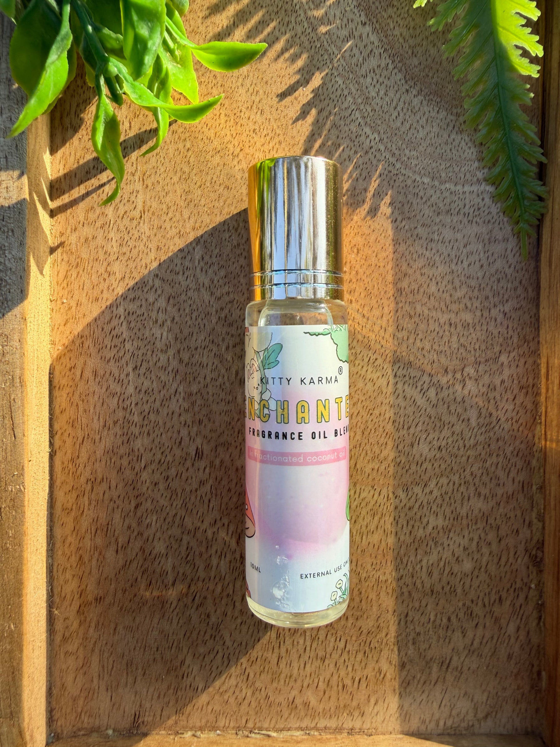Detail view of Kitty Karma Studio Enchanted perfume roller packaging
