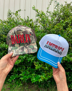 Darlin' (red font) Real Camo Canvas Trucker Hat detail view by Southern Bliss Company