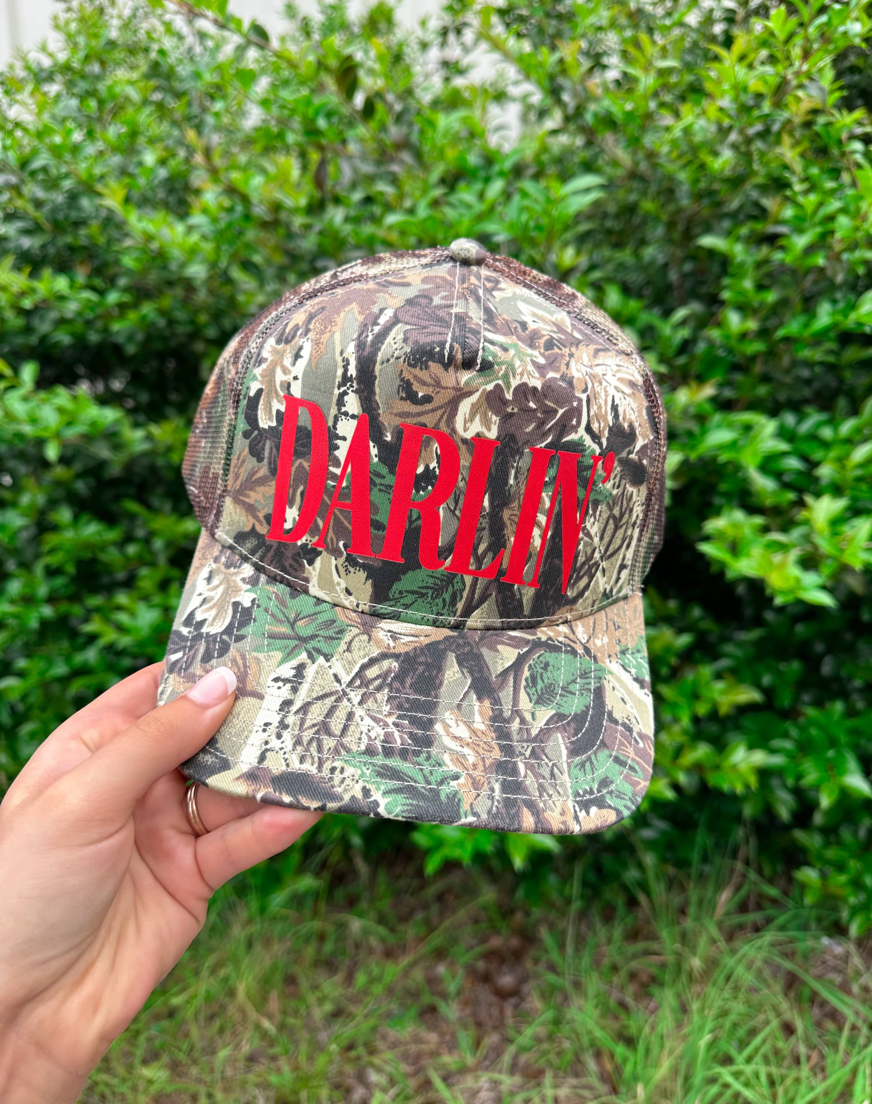 Darlin' (red font) Real Camo Canvas Trucker Hat by Southern Bliss Company