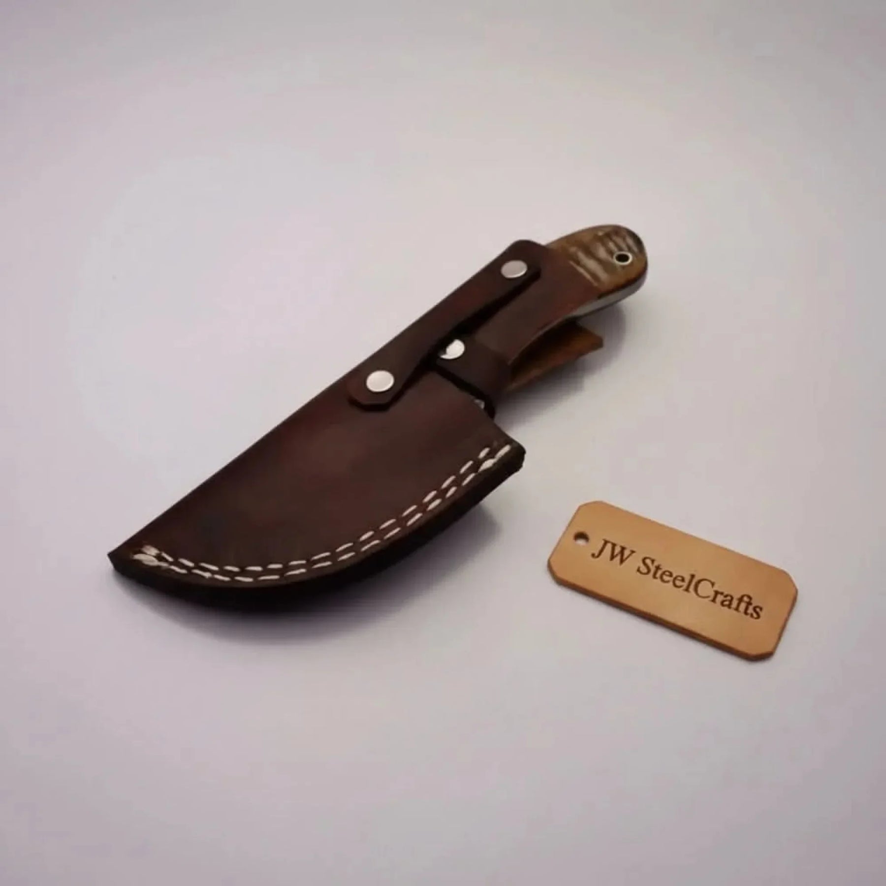 Damascus Gut hook Skinner Knife Raindrop pattern | two handle options detail view by JW SteelCrafts