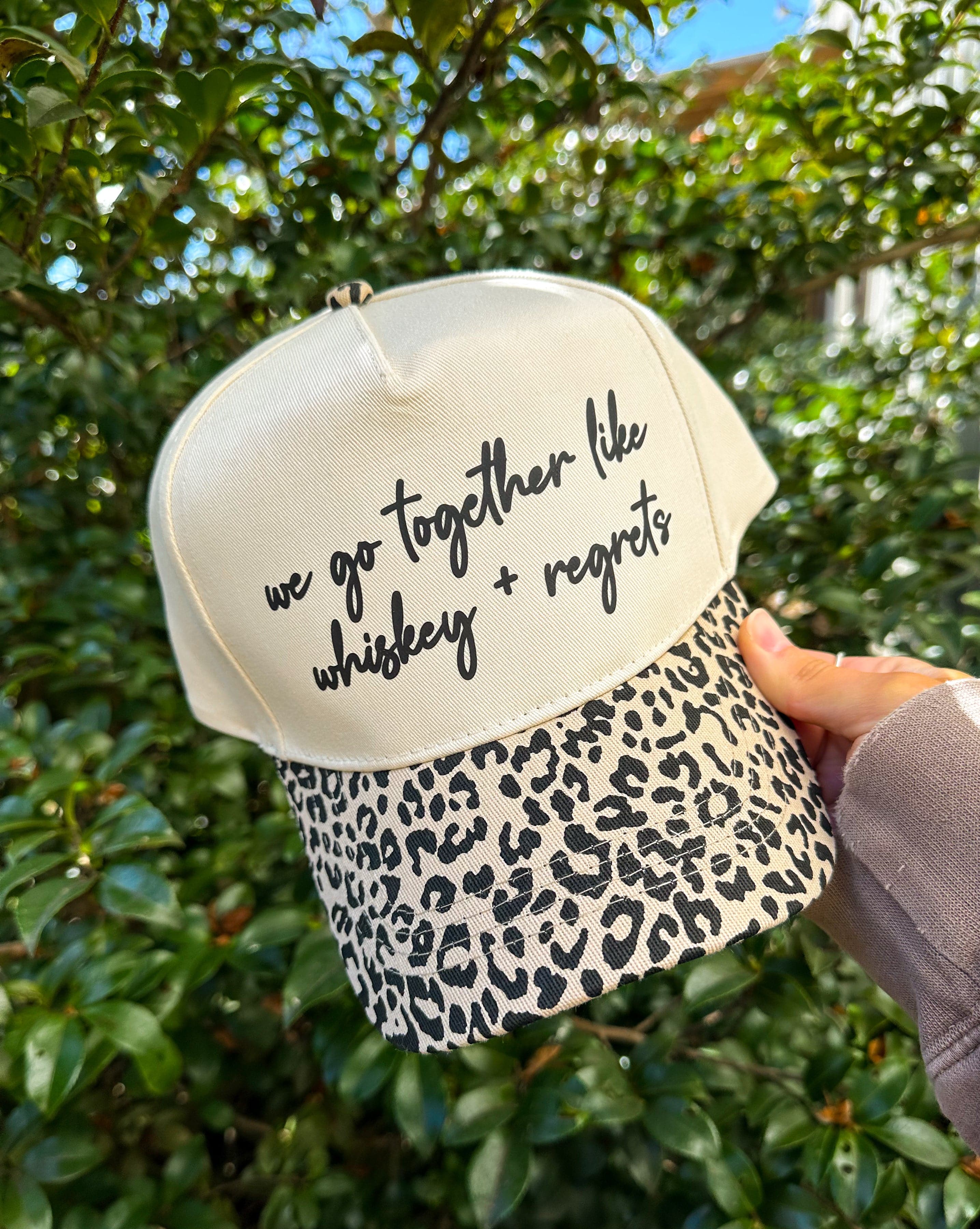 Whiskey & Regrets Leopard Canvas Trucker Hat by Southern Bliss Company, Southern lifestyle apparel main product photo