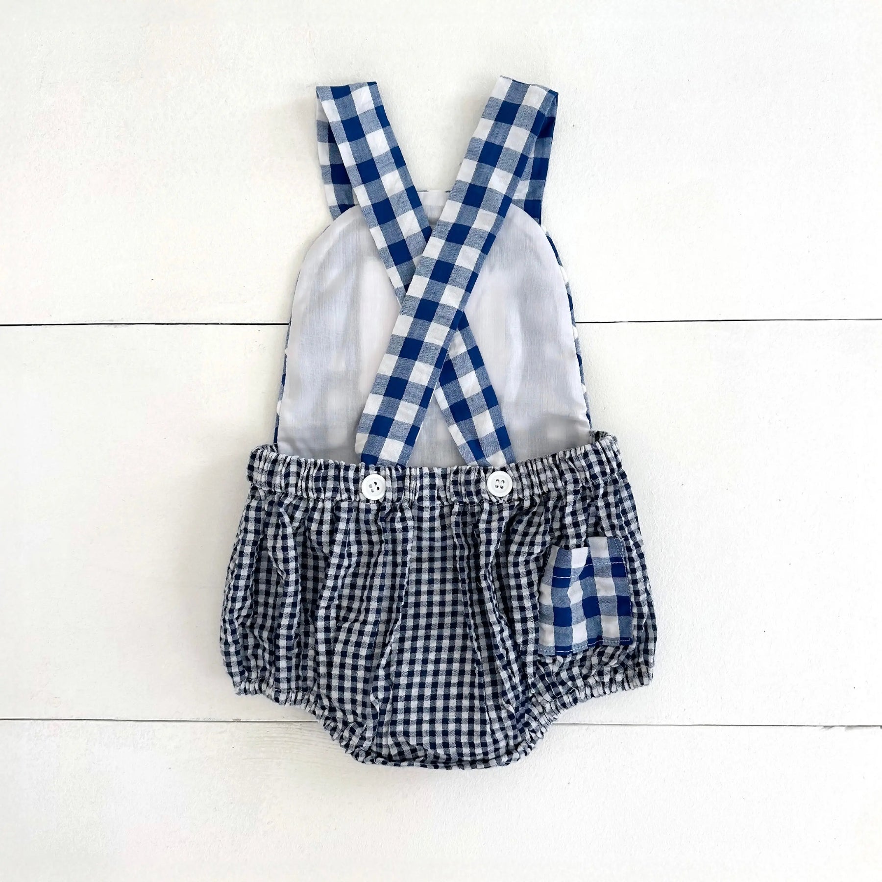 Navy Blue Smocked First Birthday Sunsuit by Seven Lantern Lane, children's boutique clothing detail photo 2