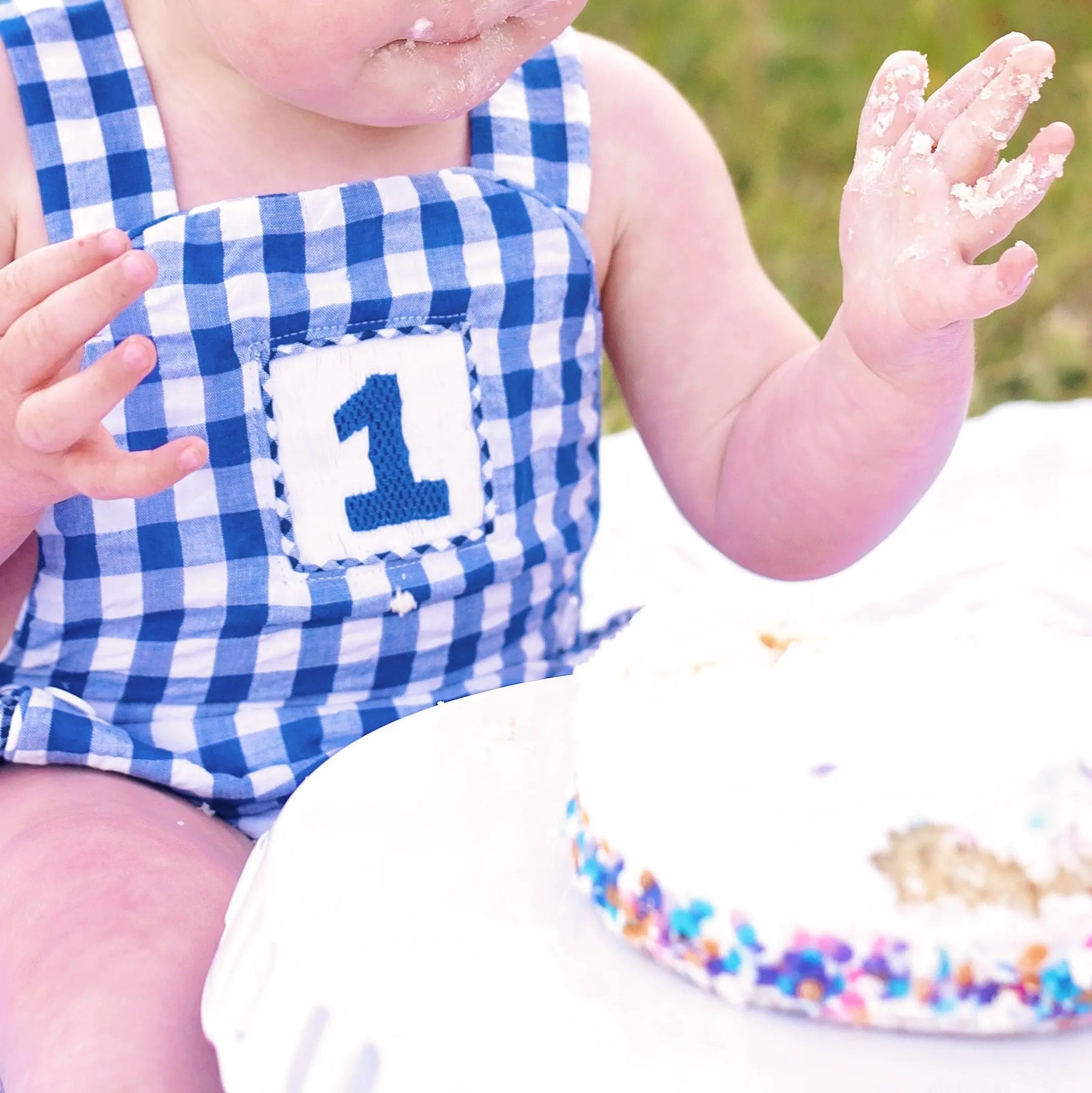 Navy Blue Smocked First Birthday Sunsuit by Seven Lantern Lane, children's boutique clothing detail photo 4