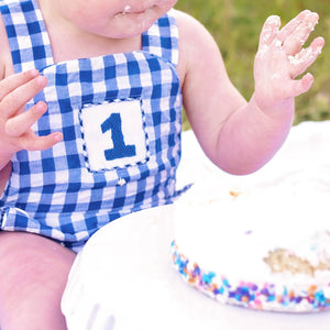 Navy Blue Smocked First Birthday Sunsuit by Seven Lantern Lane, children's boutique clothing detail photo 4