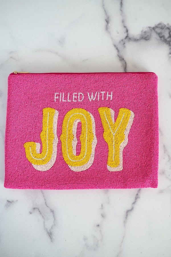 The Filled With Joy Clutch by TheTinyTassel, handmade leather goods main product photo