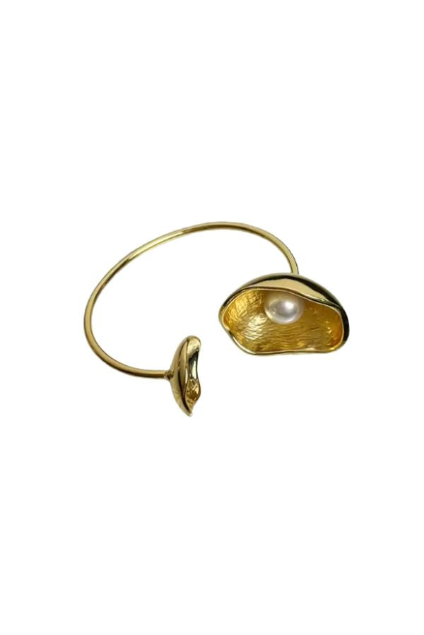 The Oyster Bangle in Gold by The Tiny Tassel