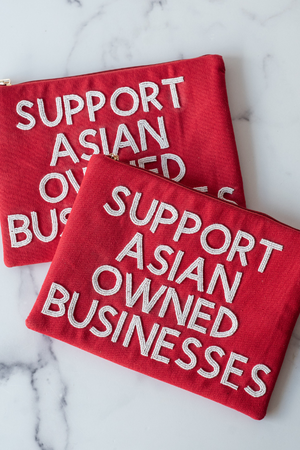 The Support Asian Owned Businesses Clutch by TheTinyTassel, handmade leather goods main product photo