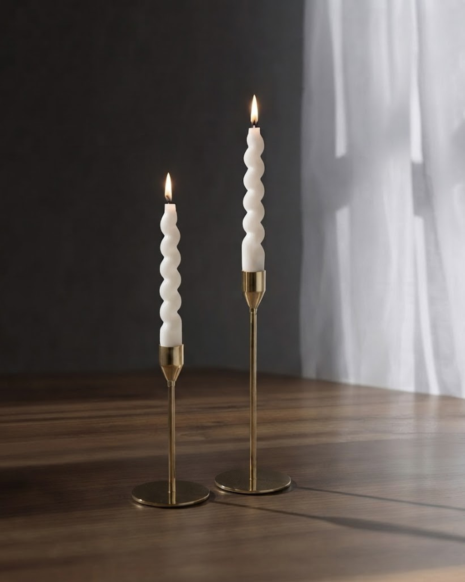 Hand-poured swirl taper candles in a modern minimalist setting