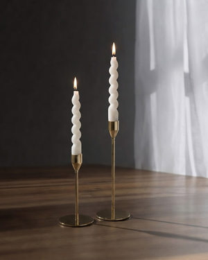 Hand-poured swirl taper candles in a modern minimalist setting