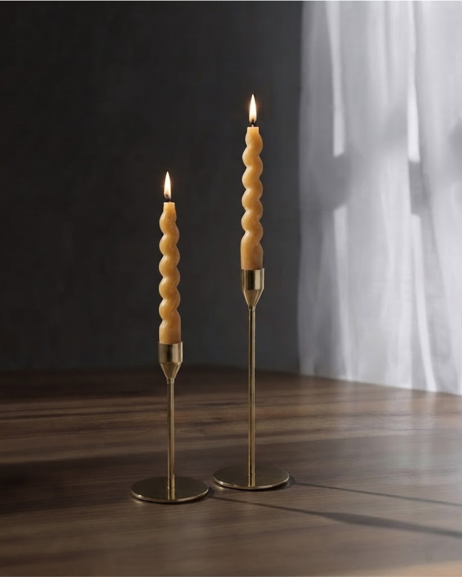 Sculptural swirl taper candles styled for dining table decor