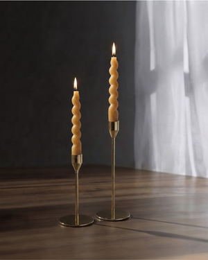 Sculptural swirl taper candles styled for dining table decor