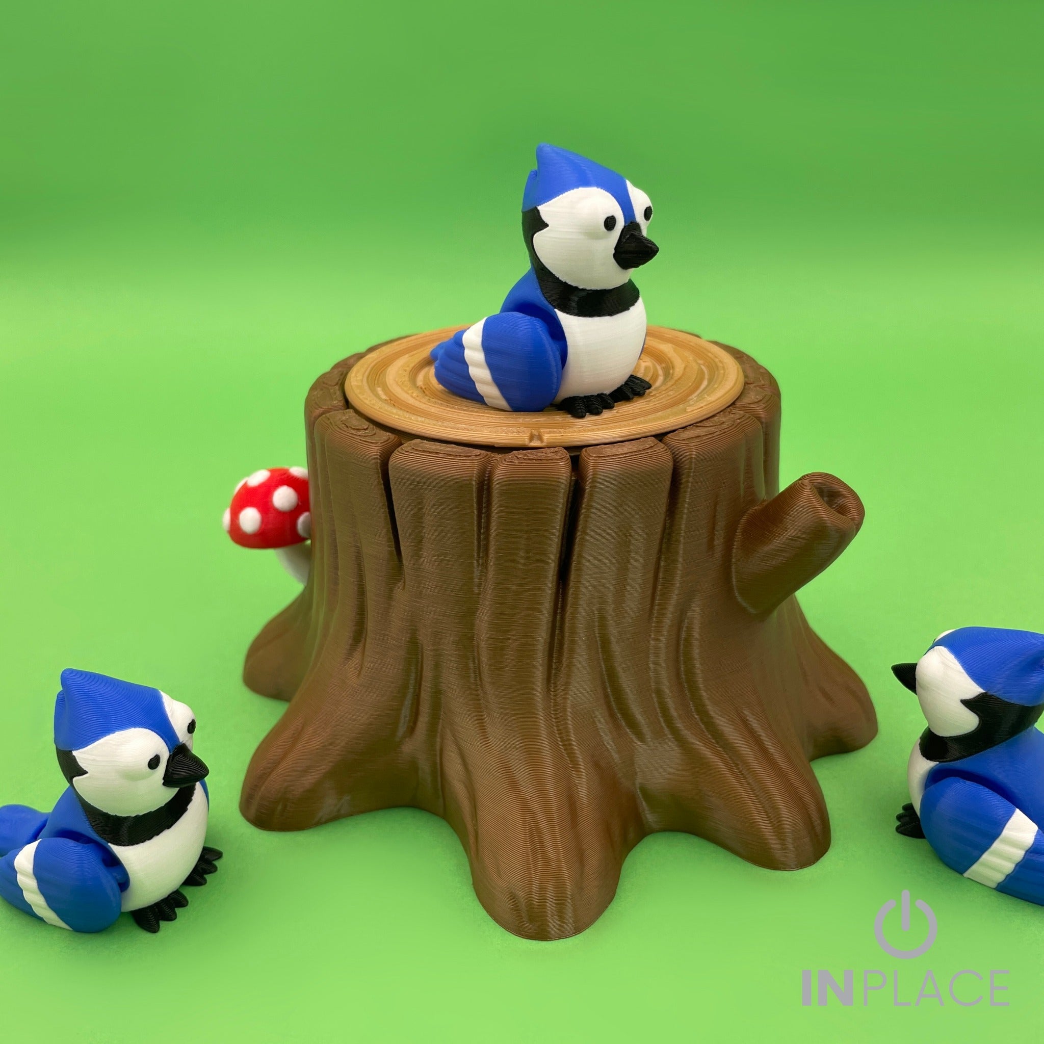 Blue jay tree stump playset side view with three birds