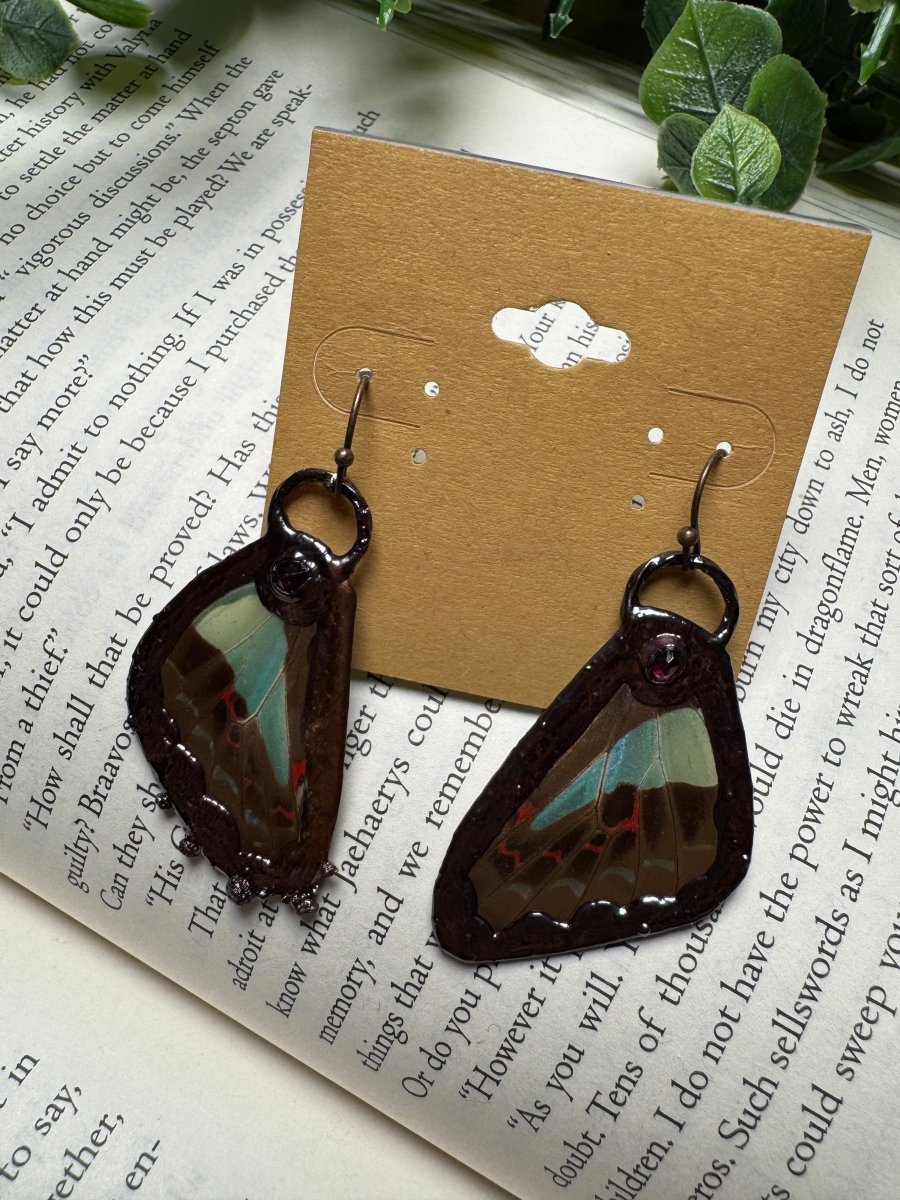 Butterfly Wing and Garnet Earrings detail view by Copper Ashes