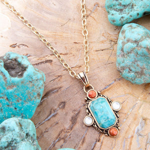 Champs Blue Turquoise and Orange Coral Golden Pendant Necklace detail view by Barse Jewelry