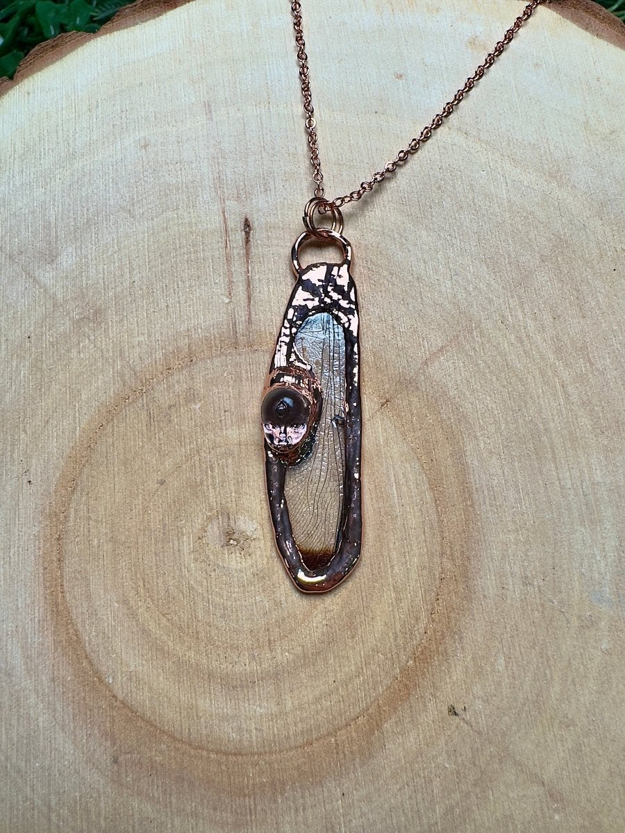 Dragonfly Wing and Resin Face Necklace detail view by Copper Ashes