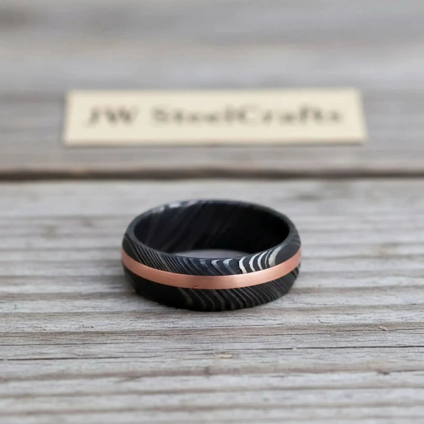 Damascus Offset Copper Inlay Ring with a Domed Dark Band detail view by JW SteelCrafts