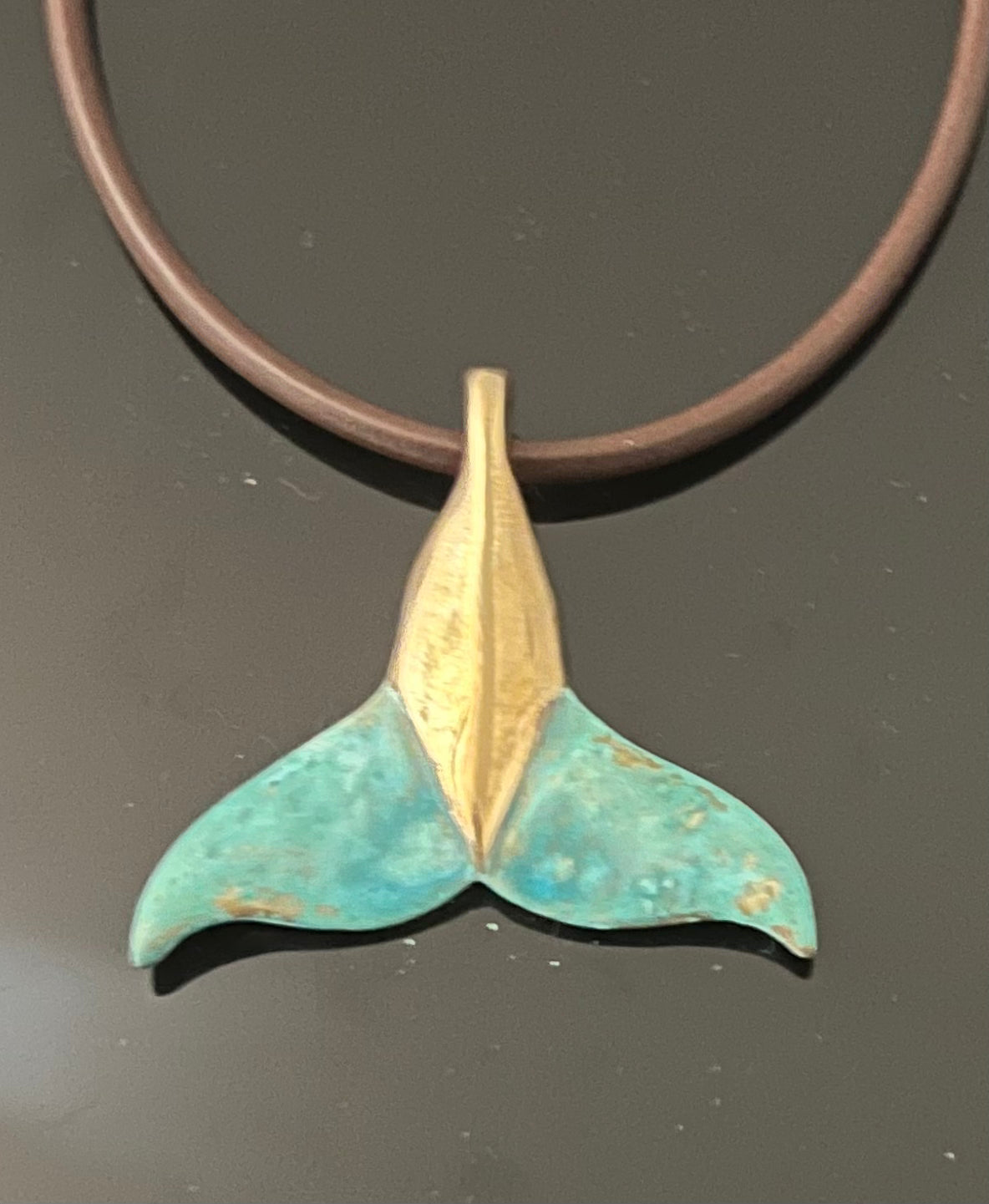 Bronze Dolphin Tail Pendant with Verde Patina by Anisa Jewelry
