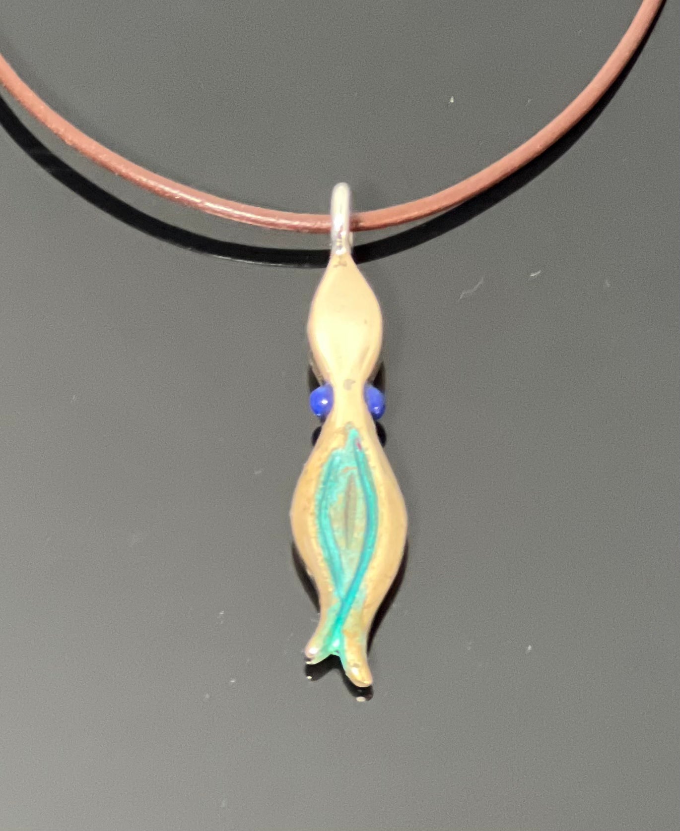 Small Bronze Squid Pendant with Lapis Eyes by Anisa Jewelry