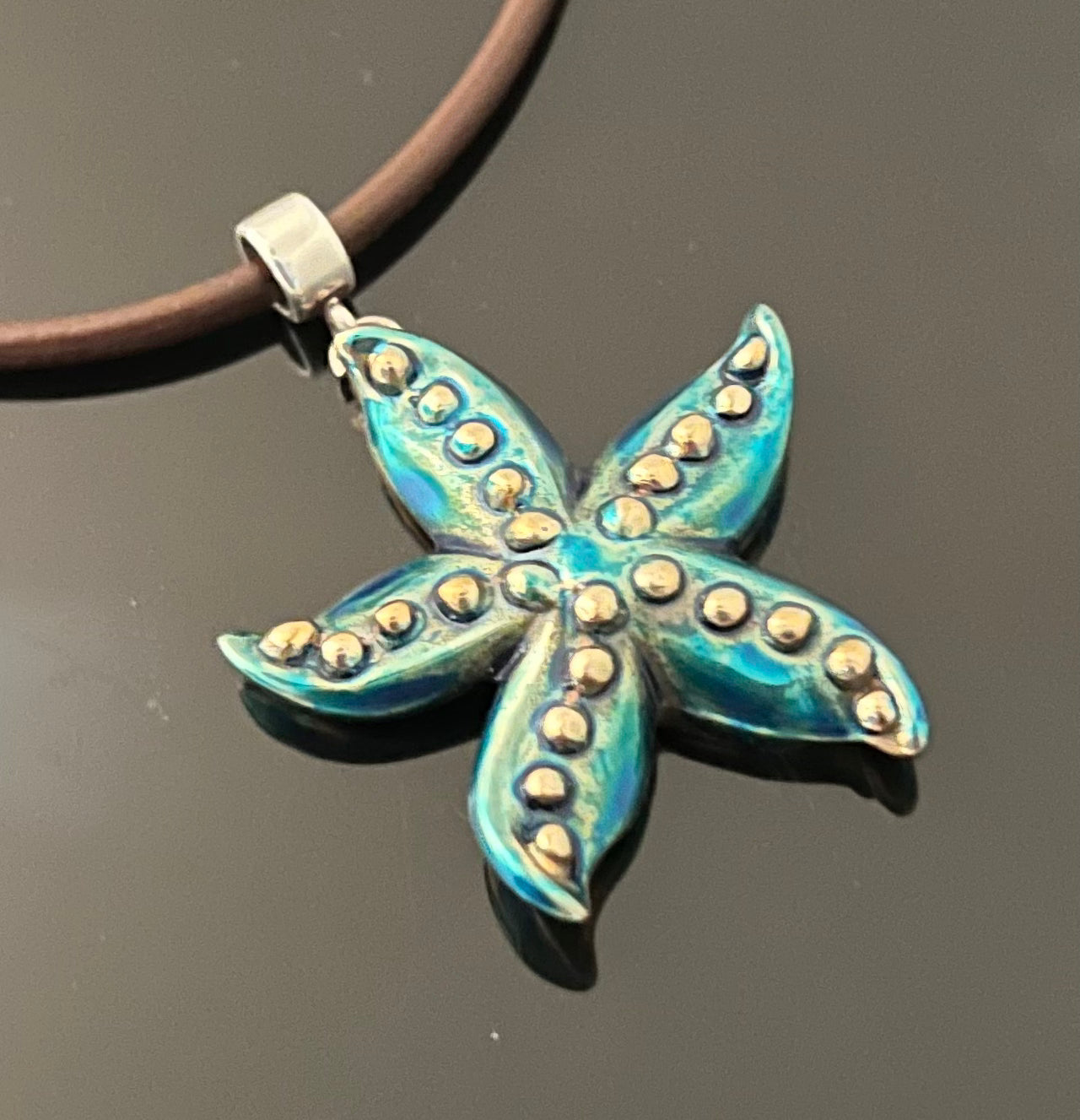Bronze Starfish Pendant with Blue Patina by Anisa Jewelry