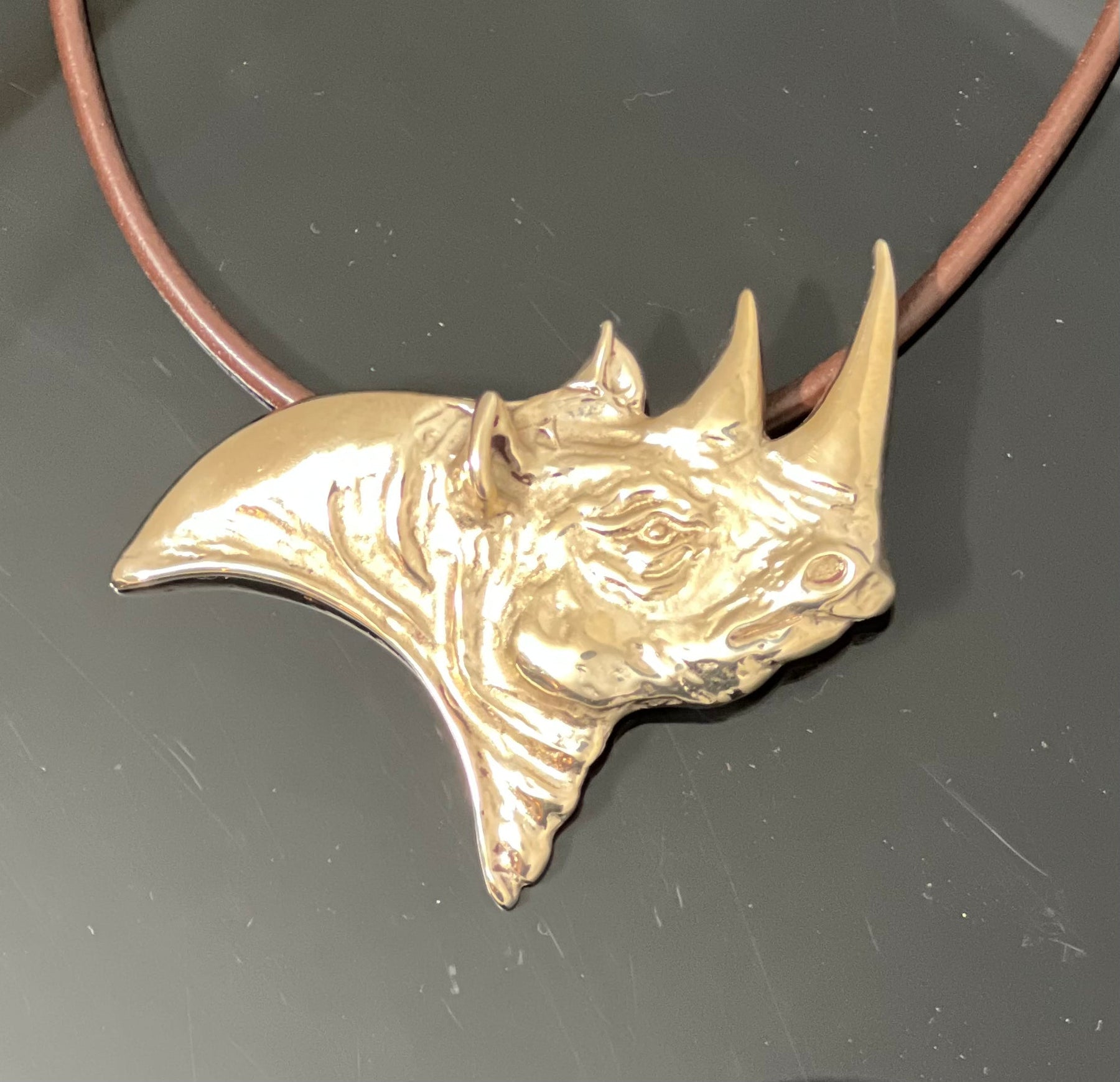 Bronze Rhino Pendant on Leather Cord by Anisa Jewelry