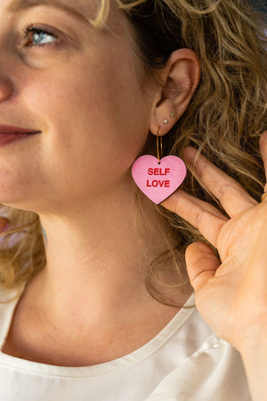 Additional view of Self Love Conversation Heart Hoop Earrings hand painted on lightweight wood by LE CHIC MIAMI