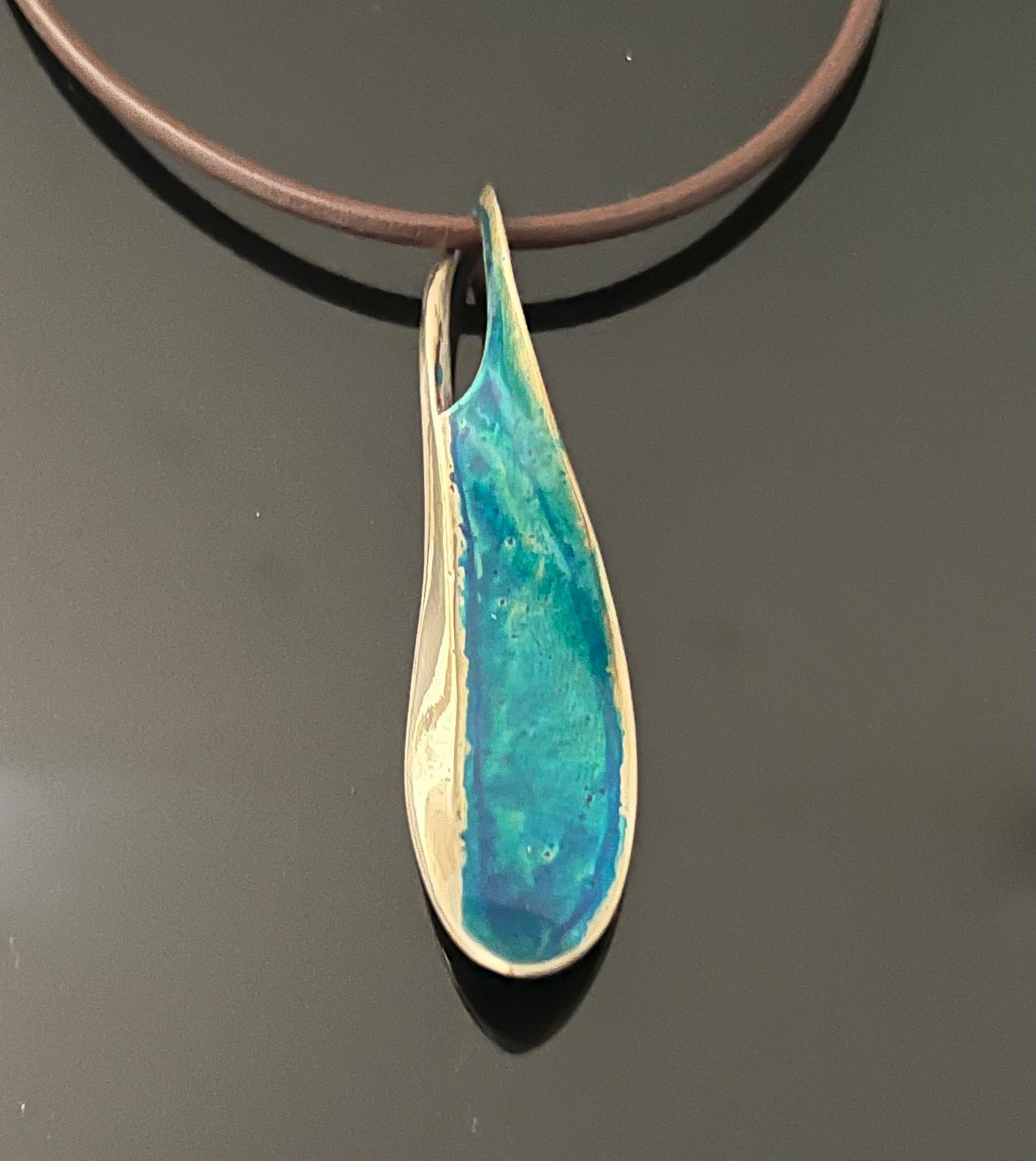 Bronze Wave Pendant with Blue Patina by Anisa Jewelry