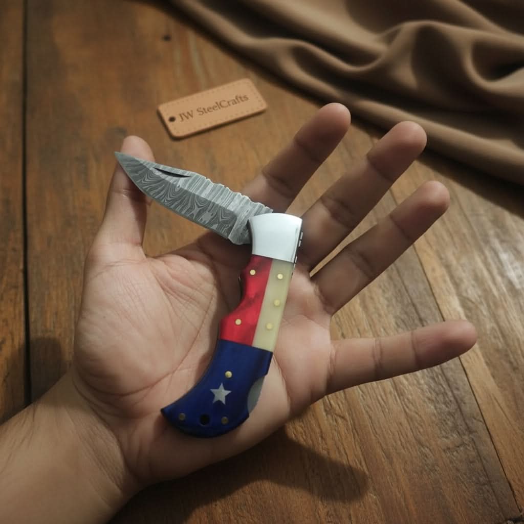 Handmade Damascus Folding Knife – Tricolor Resin Handle (Red, White & Blue) with Leather Sheath by JW SteelCrafts, leather knife sheath main product photo