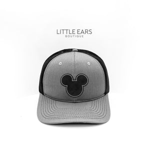 Black & Silver Trucker Hat by Little Ears Boutique, Southern lifestyle apparel main product photo