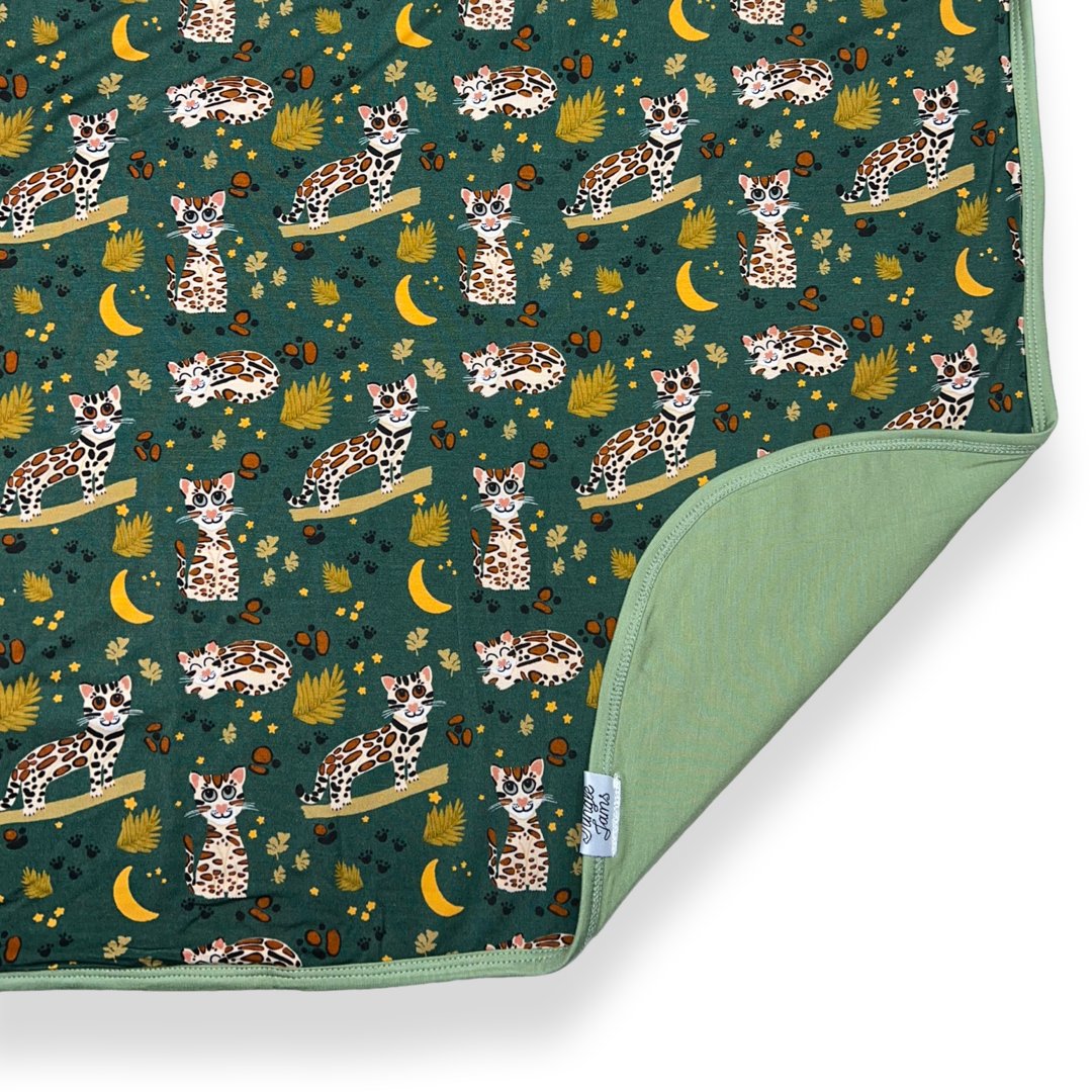 Ocelot reversible bamboo blanket with hand drawn animal print