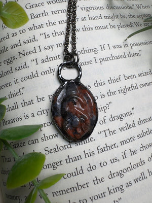 Red Que Sera Yoni Necklace detail view by Copper Ashes