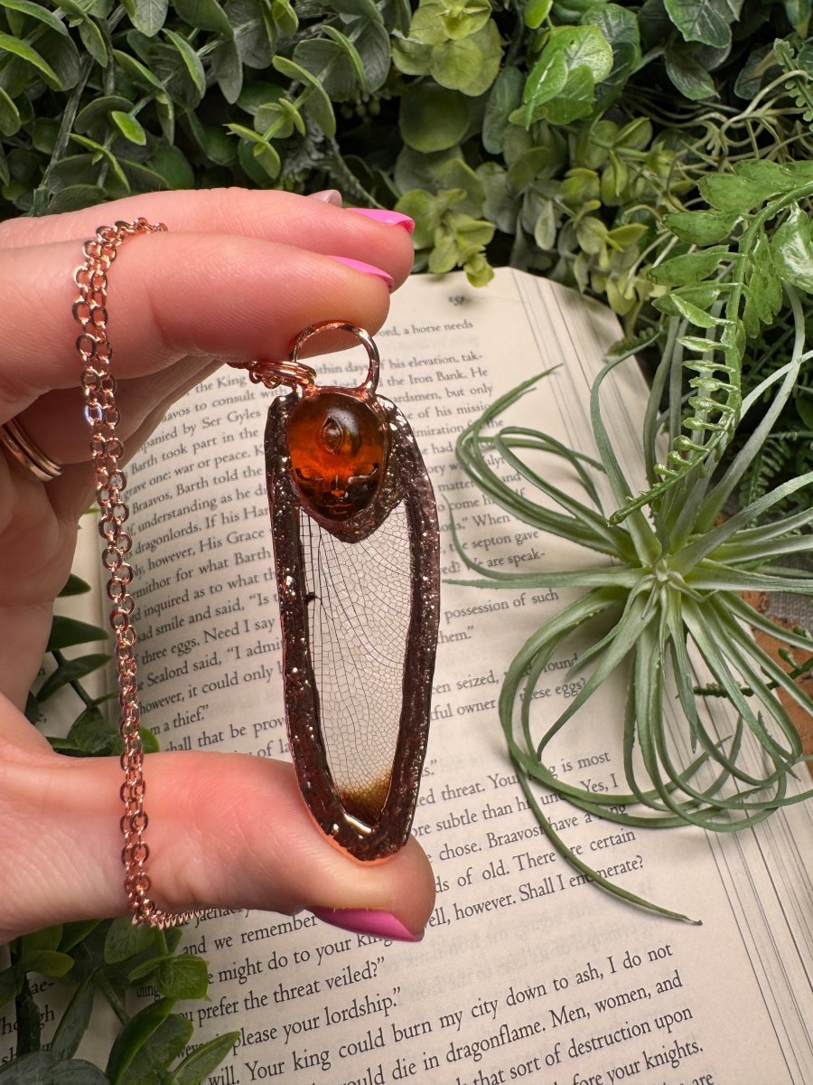 Resin Face and Dragonfly Wing Necklace by Copper Ashes