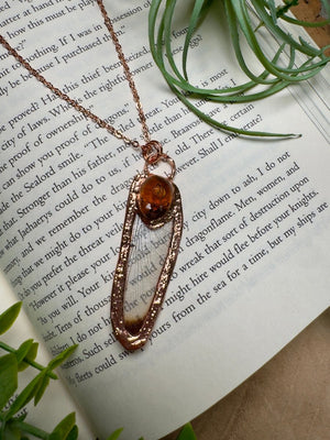 Resin Face and Dragonfly Wing Necklace detail view by Copper Ashes