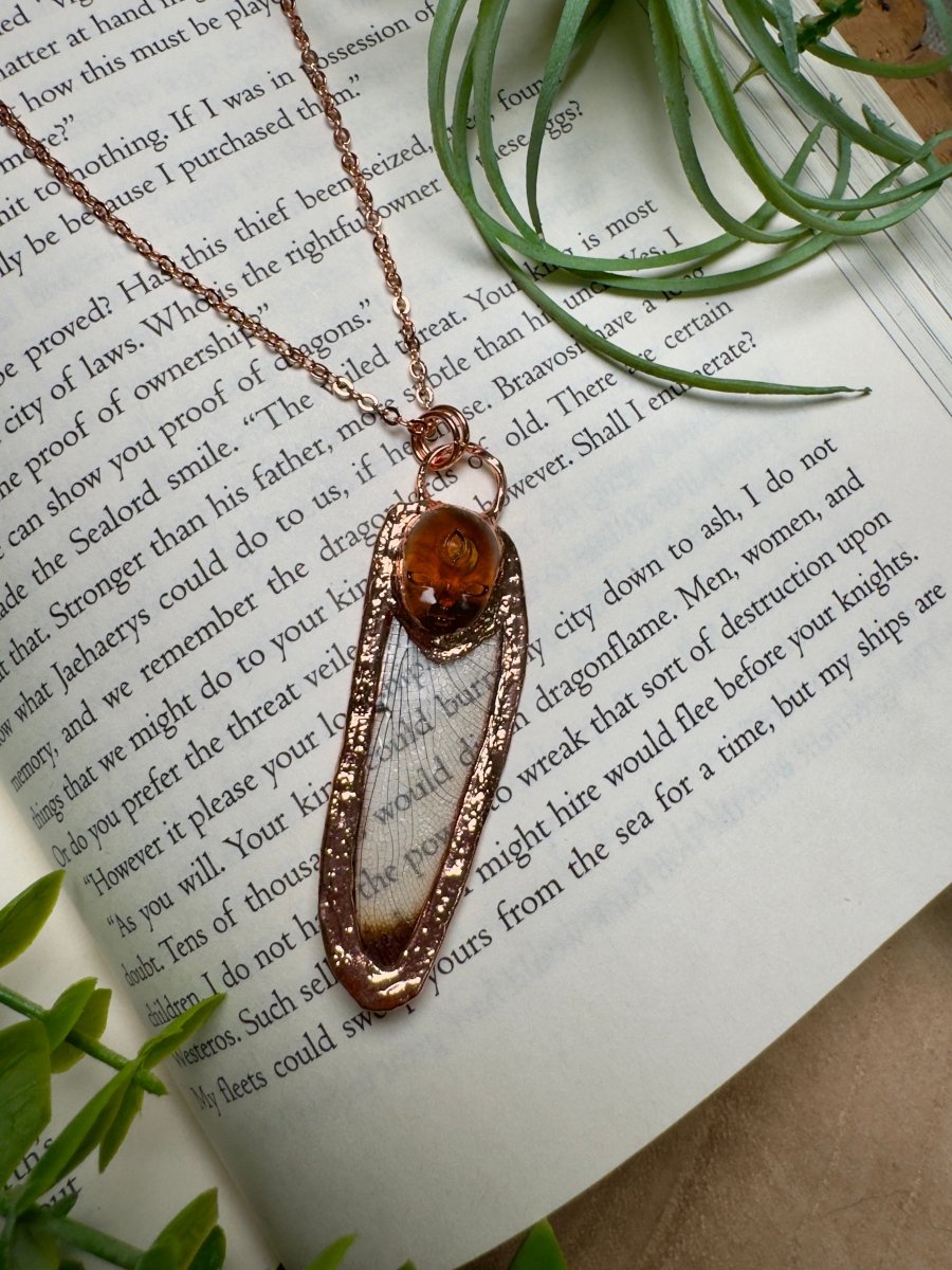 Resin Face and Dragonfly Wing Necklace detail view by Copper Ashes