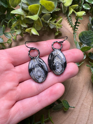 Snowflake Obsidian Yoni Earrings detail view by Copper Ashes